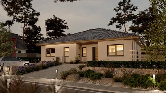 Abendstimmung am modernen Massivhaus in Diepholz Moderner Bungalow bei Sonnenuntergang als Inspiration für den Hausbau in Diepholz