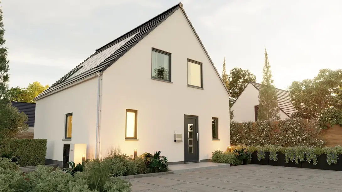 Einfamilienhaus mit heller Fassade, Satteldach und Vorgarten in Wagenfeld-Ströhen