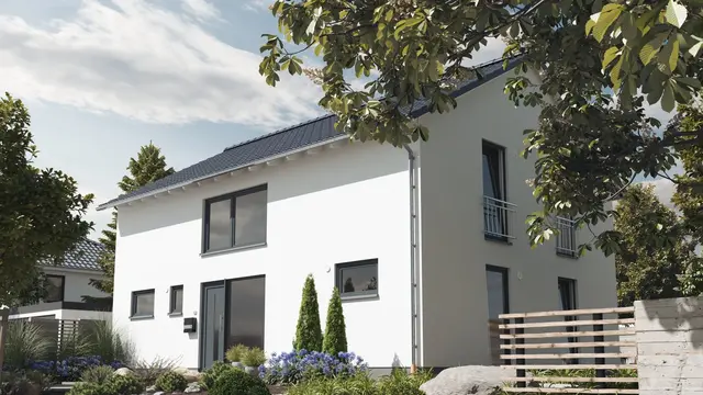 Modernes Einfamilienhaus mit heller Putzfassade, Satteldach, Vorgarten und gepflegter Einfahrt