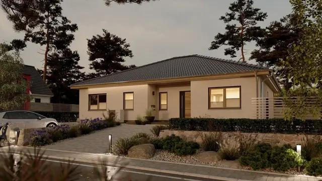 Moderner Bungalow bei Sonnenuntergang als Inspiration für den Hausbau in Diepholz
